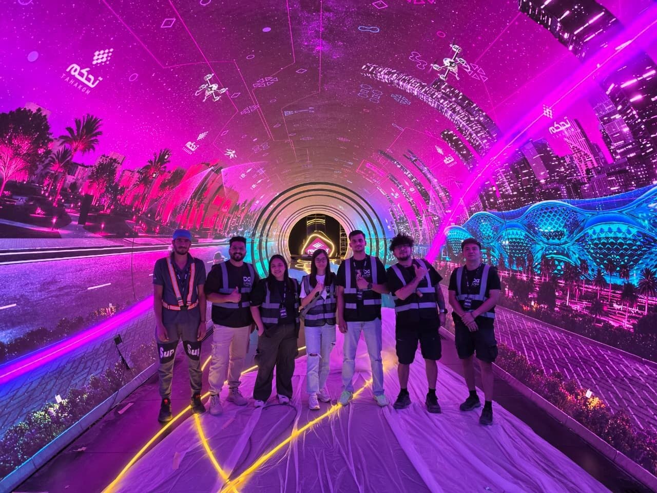 The E2B team inside an immersive LED tunnel